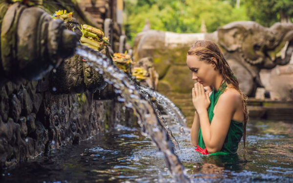 Woman,In,Holy,Spring,Water,Temple,In,Bali.,The,Temple