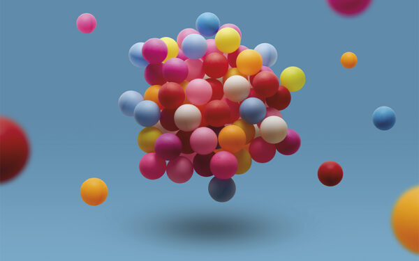 Multi,Colored,Balls,Levitation,In,Mid,Air,On,Blue,Background.