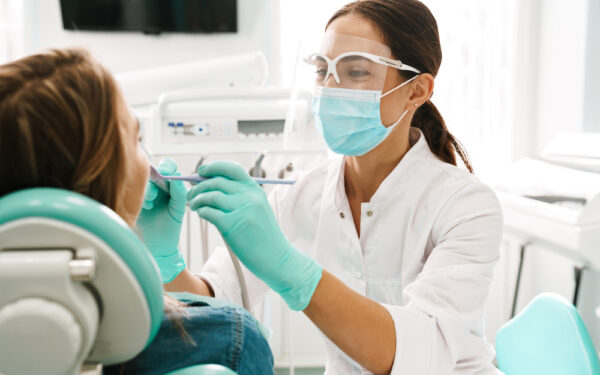 European,Mid,Pleased,Dentist,Woman,In,Face,Mask,Working,In