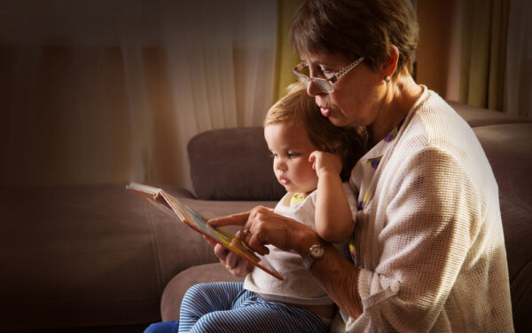 Grandmother,Reading,A,Tale,To,Her,Baby,Granddaughter.,Family,Reading