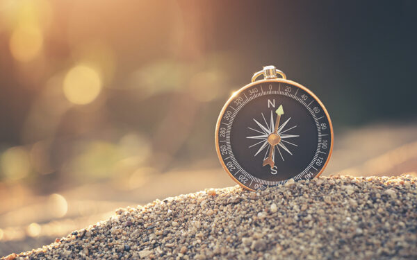 Travel,Of,Tourists,With,Compass.,Compass,Of,Tourists,On,Sandy